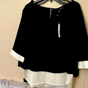 Black and white top with zip back excellent condition